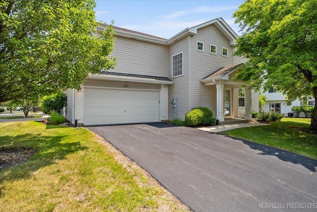 251 Abington Ln, North Aurora, IL 60542 - view of front of property featuring driveway, an attached garage, and a front yard