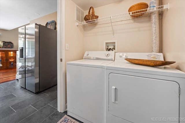 251 Abington Ln, North Aurora, IL 60542 - washroom with washer and dryer and dark tile patterned floors