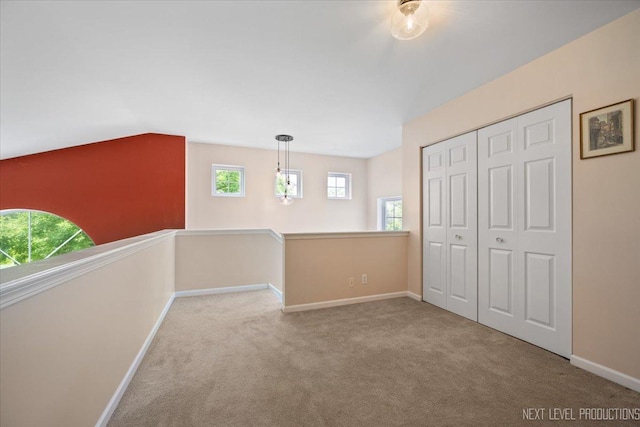 251 Abington Ln, North Aurora, IL 60542 - unfurnished bedroom with carpet flooring, a closet, and vaulted ceiling