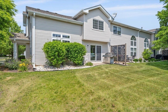 251 Abington Ln, North Aurora, IL 60542 - rear view of house with a yard