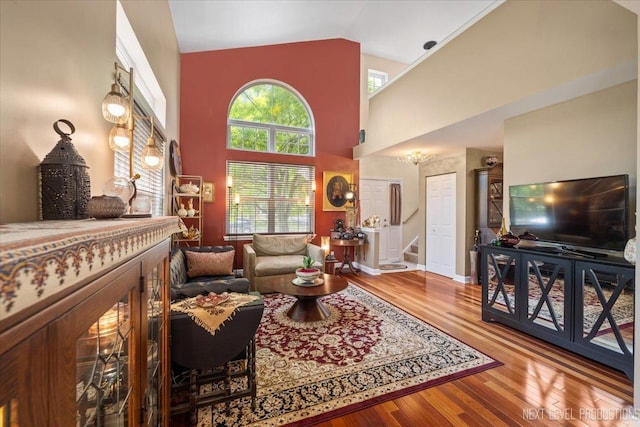 251 Abington Ln, North Aurora, IL 60542 - living area featuring wood finished floors, stairs, and high vaulted ceiling