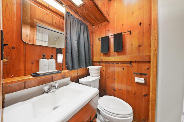 3720 E Lake Shore Dr, Wonder Lake, IL 60097 - bathroom featuring wooden walls and vanity