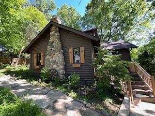 3720 E Lake Shore Dr, Wonder Lake, IL 60097 - view of side of home with a chimney
