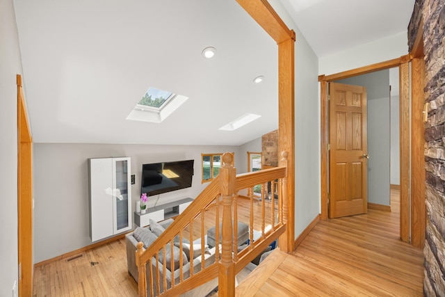 1649 Larry Ln, Glendale Heights, IL 60139 - hall featuring a skylight, wood finished floors, an upstairs landing, recessed lighting, and vaulted ceiling