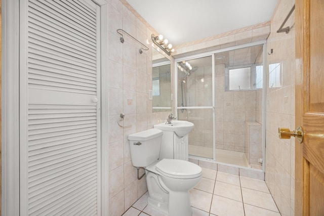 1649 Larry Ln, Glendale Heights, IL 60139 - bathroom featuring tile walls, a shower stall, and tile patterned flooring