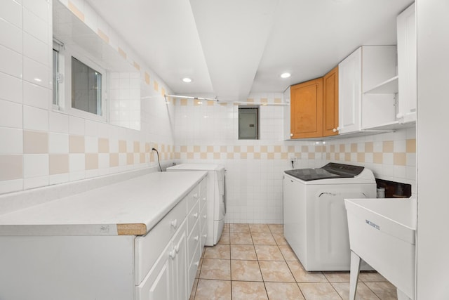 1649 Larry Ln, Glendale Heights, IL 60139 - laundry room featuring washer and dryer, electric panel, cabinet space, recessed lighting, and light tile patterned floors