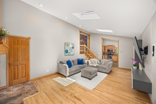 1649 Larry Ln, Glendale Heights, IL 60139 - living area featuring a skylight, light wood-style flooring, stairs, and recessed lighting