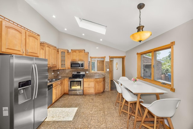 1649 Larry Ln, Glendale Heights, IL 60139 - kitchen featuring stainless steel appliances, lofted ceiling, a skylight, recessed lighting, and backsplash