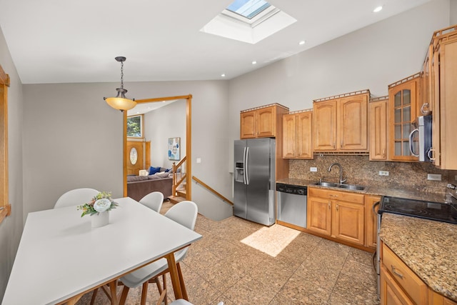 1649 Larry Ln, Glendale Heights, IL 60139 - kitchen with appliances with stainless steel finishes, a skylight, backsplash, glass insert cabinets, and recessed lighting