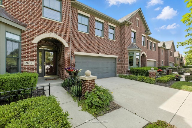 21730 Higley Ln, Frankfort, IL 60423 - view of front facade with brick siding, a garage, a residential view, and driveway