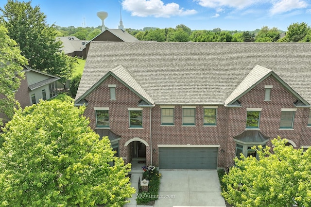 21730 Higley Ln, Frankfort, IL 60423 - view of front of home with a shingled roof, an attached garage, concrete driveway, and brick siding