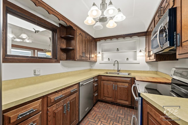 330 S Maple St, Itasca, IL 60143 - kitchen with stainless steel appliances, a chandelier, light countertops, brick patterned floors, and open shelves
