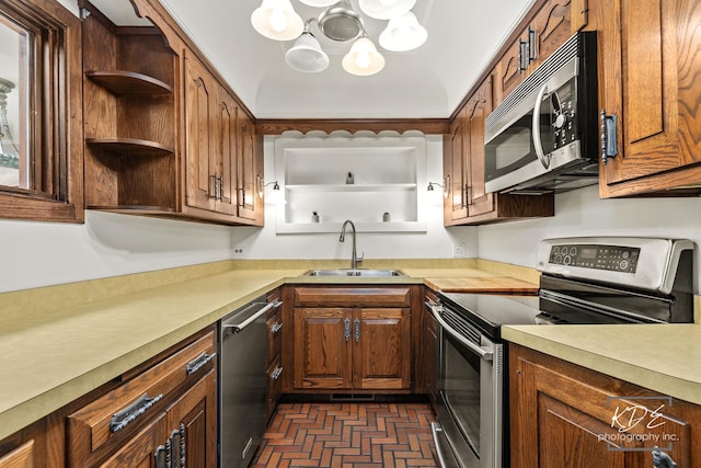 330 S Maple St, Itasca, IL 60143 - kitchen featuring appliances with stainless steel finishes, light countertops, brick patterned flooring, open shelves, and a chandelier