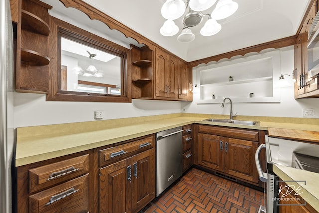 330 S Maple St, Itasca, IL 60143 - kitchen featuring stainless steel appliances, open shelves, a chandelier, light countertops, and brick patterned flooring