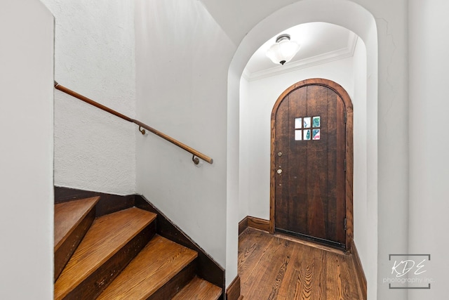 330 S Maple St, Itasca, IL 60143 - entryway with arched walkways, wood finished floors, crown molding, and stairs