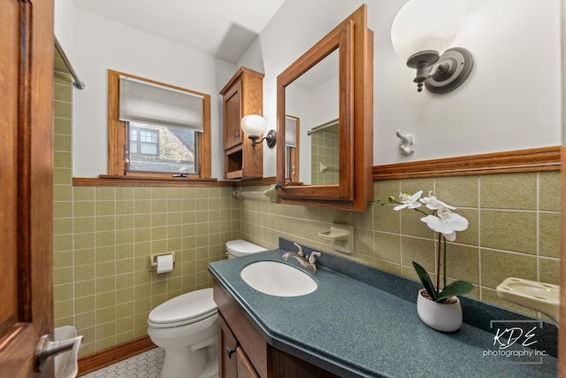 330 S Maple St, Itasca, IL 60143 - bathroom featuring tile walls, vanity, tile patterned flooring, and wainscoting