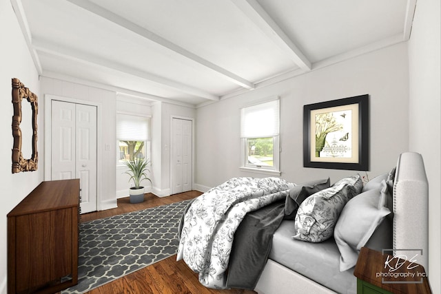 330 S Maple St, Itasca, IL 60143 - bedroom featuring beam ceiling, dark wood-style floors, and two closets