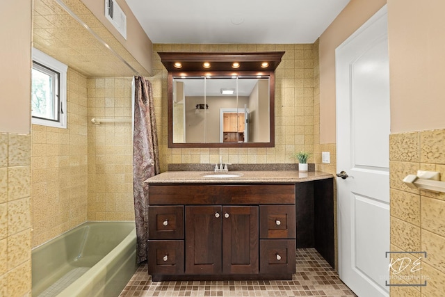 330 S Maple St, Itasca, IL 60143 - bathroom featuring tile walls, vanity, and shower / tub combo with curtain