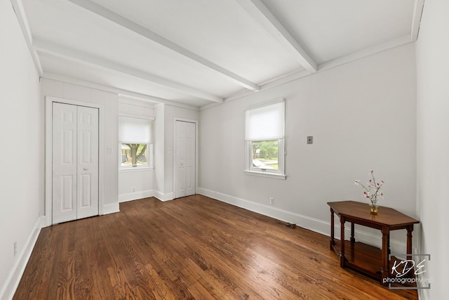 330 S Maple St, Itasca, IL 60143 - unfurnished bedroom with multiple windows, dark wood-type flooring, beamed ceiling, and two closets