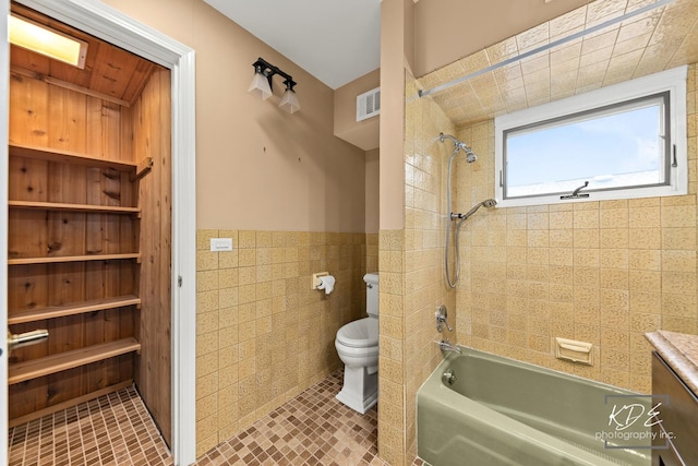 330 S Maple St, Itasca, IL 60143 - bathroom with tile walls, shower / tub combination, a wainscoted wall, tile patterned floors, and vanity