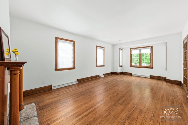 330 S Maple St, Itasca, IL 60143 - unfurnished living room with a baseboard heating unit and wood finished floors