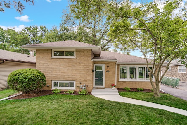 3115 172nd St, Hazel Crest, IL 60429 - tri-level home featuring brick siding, a front yard, and roof with shingles