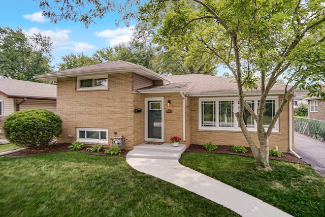 3115 172nd St, Hazel Crest, IL 60429 - tri-level home featuring brick siding, a front yard, and roof with shingles