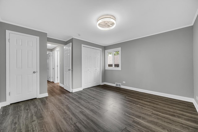 3115 172nd St, Hazel Crest, IL 60429 - unfurnished bedroom with dark wood-type flooring, ornamental molding, and a closet