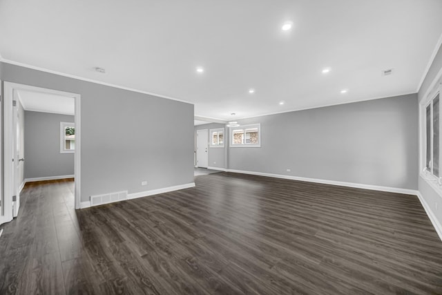 3115 172nd St, Hazel Crest, IL 60429 - empty room featuring ornamental molding, healthy amount of natural light, dark wood finished floors, and recessed lighting