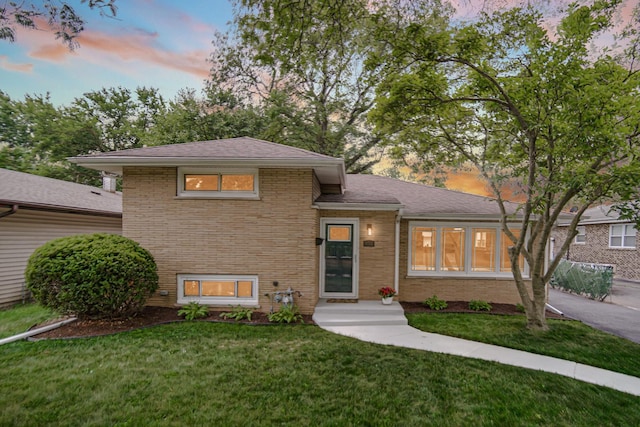 3115 172nd St, Hazel Crest, IL 60429 - tri-level home with brick siding, a front lawn, and roof with shingles