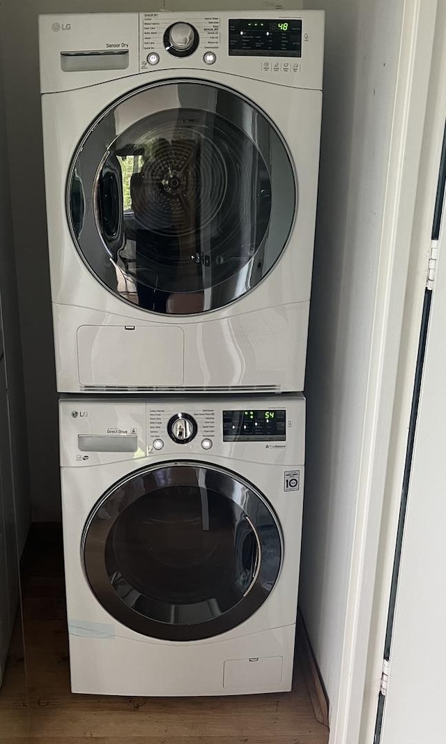 505 N Lake Shore Dr Unit 516, Chicago, IL 60611 - washroom with estacked washer and dryer and wood finished floors