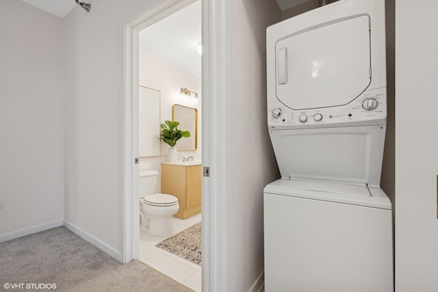 330 W Grand Ave Unit 904, Chicago, IL 60654 - laundry room with stacked washer / dryer and carpet flooring