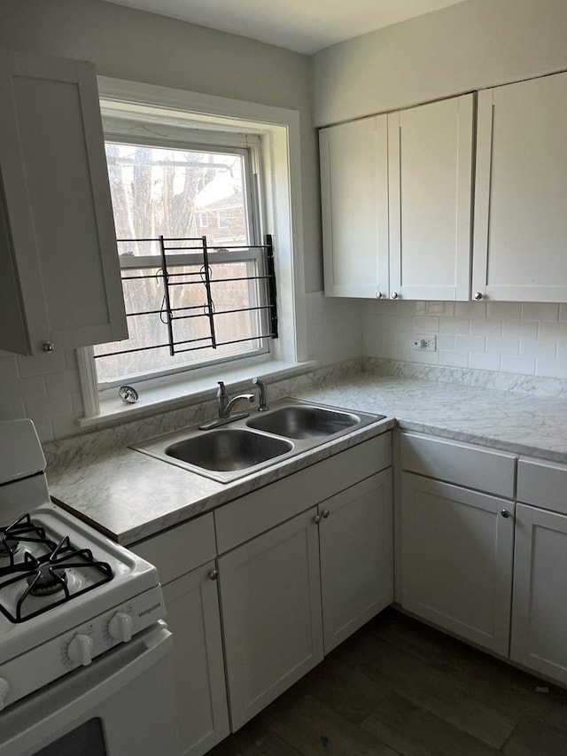 9611 S Chappel Ave, Chicago, IL 60617 - kitchen featuring gas range gas stove, white cabinetry, and tasteful backsplash