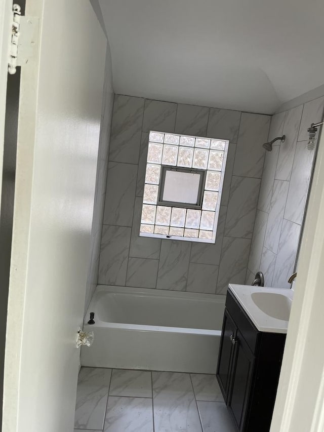 9611 S Chappel Ave, Chicago, IL 60617 - bathroom featuring marble look tiles, shower / washtub combination, and vanity