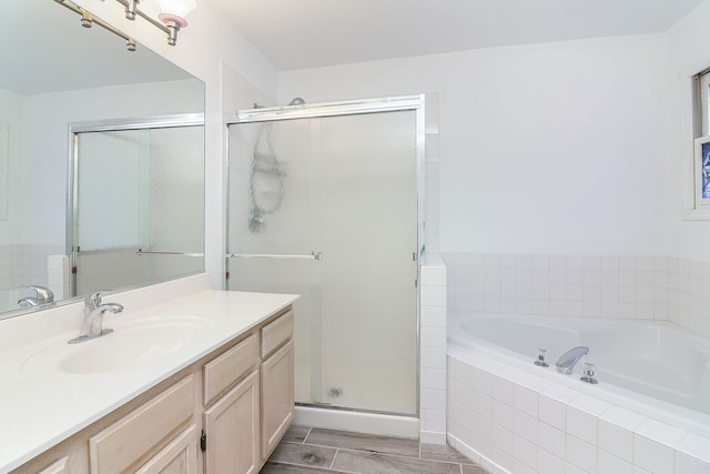 2007 Thornwood Cir, Saint Charles, IL 60174 - bathroom featuring vanity, a garden tub, a stall shower, and wood finished floors