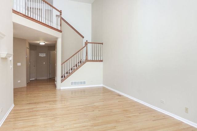 2007 Thornwood Cir, Saint Charles, IL 60174 - unfurnished living room featuring light wood-type flooring and stairway