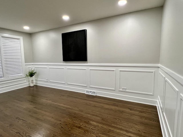12837 S Aberdeen St, Calumet Park, IL 60827 - unfurnished room featuring a wainscoted wall, recessed lighting, a decorative wall, and dark wood finished floors