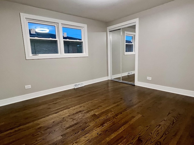 12837 S Aberdeen St, Calumet Park, IL 60827 - unfurnished bedroom with dark wood-type flooring and a closet