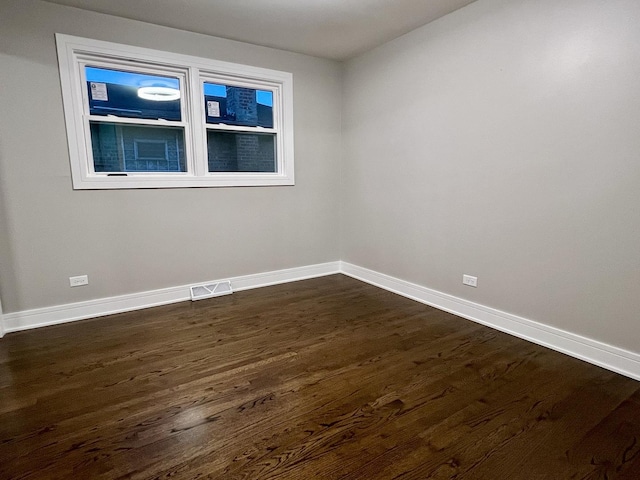 12837 S Aberdeen St, Calumet Park, IL 60827 - empty room with dark wood-style flooring