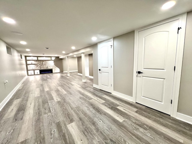 12837 S Aberdeen St, Calumet Park, IL 60827 - unfurnished living room with a stone fireplace, recessed lighting, and wood finished floors