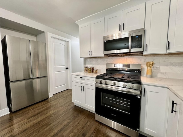 12837 S Aberdeen St, Calumet Park, IL 60827 - kitchen featuring appliances with stainless steel finishes, dark wood-style floors, white cabinetry, and backsplash