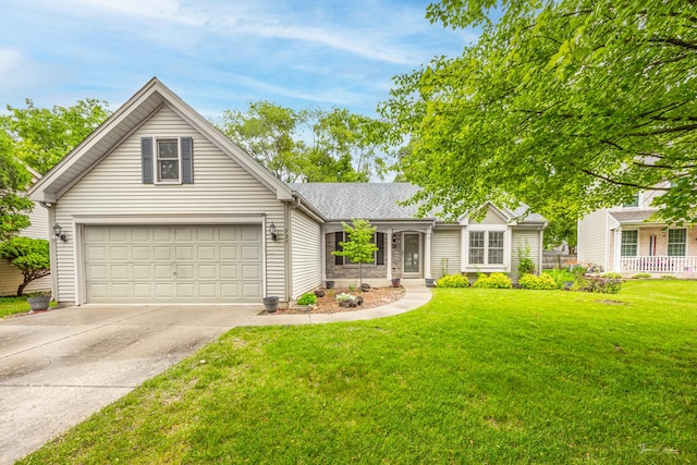 937 Wellington Cir, Aurora, IL 60506 - view of front of house with concrete driveway, a garage, and a front yard