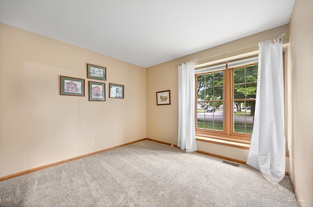 937 Wellington Cir, Aurora, IL 60506 - spare room with carpet and baseboards