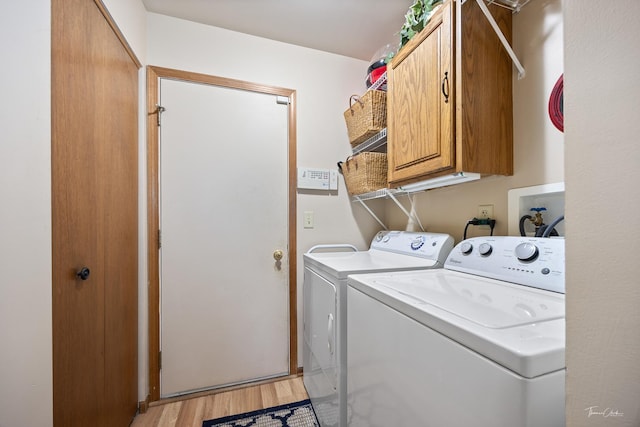 937 Wellington Cir, Aurora, IL 60506 - laundry room with cabinet space, washing machine and clothes dryer, and light wood finished floors