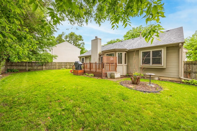 937 Wellington Cir, Aurora, IL 60506 - rear view of property with a fenced backyard, a deck, and a shingled roof
