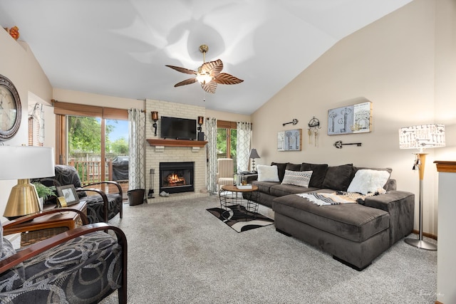 937 Wellington Cir, Aurora, IL 60506 - carpeted living area featuring healthy amount of natural light, vaulted ceiling, a ceiling fan, and a fireplace