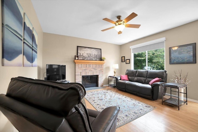 2420 Columbia Ln, Montgomery, IL 60538 - living room featuring wood finished floors, ceiling fan, and a fireplace