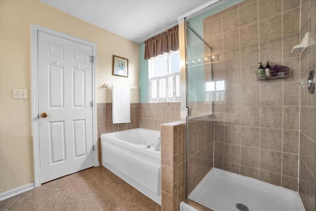 2420 Columbia Ln, Montgomery, IL 60538 - full bathroom featuring a shower stall, a garden tub, and tile walls
