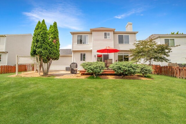 2420 Columbia Ln, Montgomery, IL 60538 - rear view of property with a chimney and a patio area