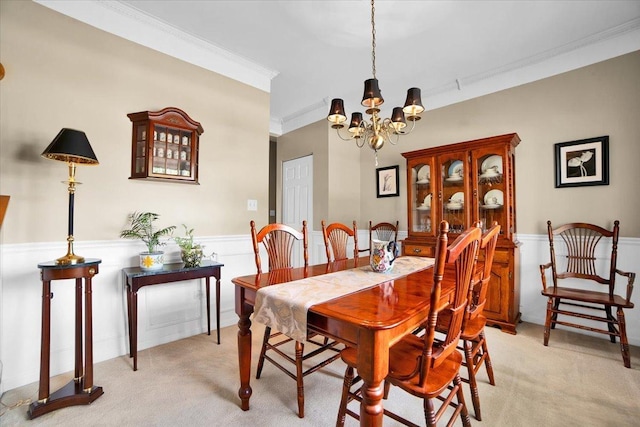 2420 Columbia Ln, Montgomery, IL 60538 - dining space featuring a chandelier, light carpet, wainscoting, and ornamental molding